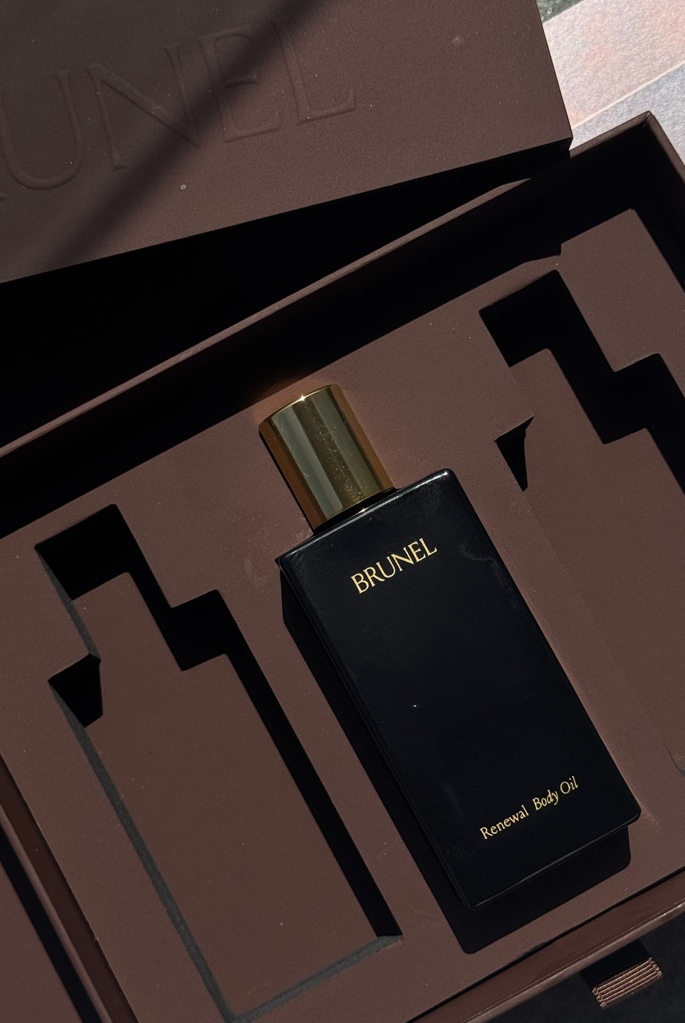 Brunel perfume bottle in a brown packaging box