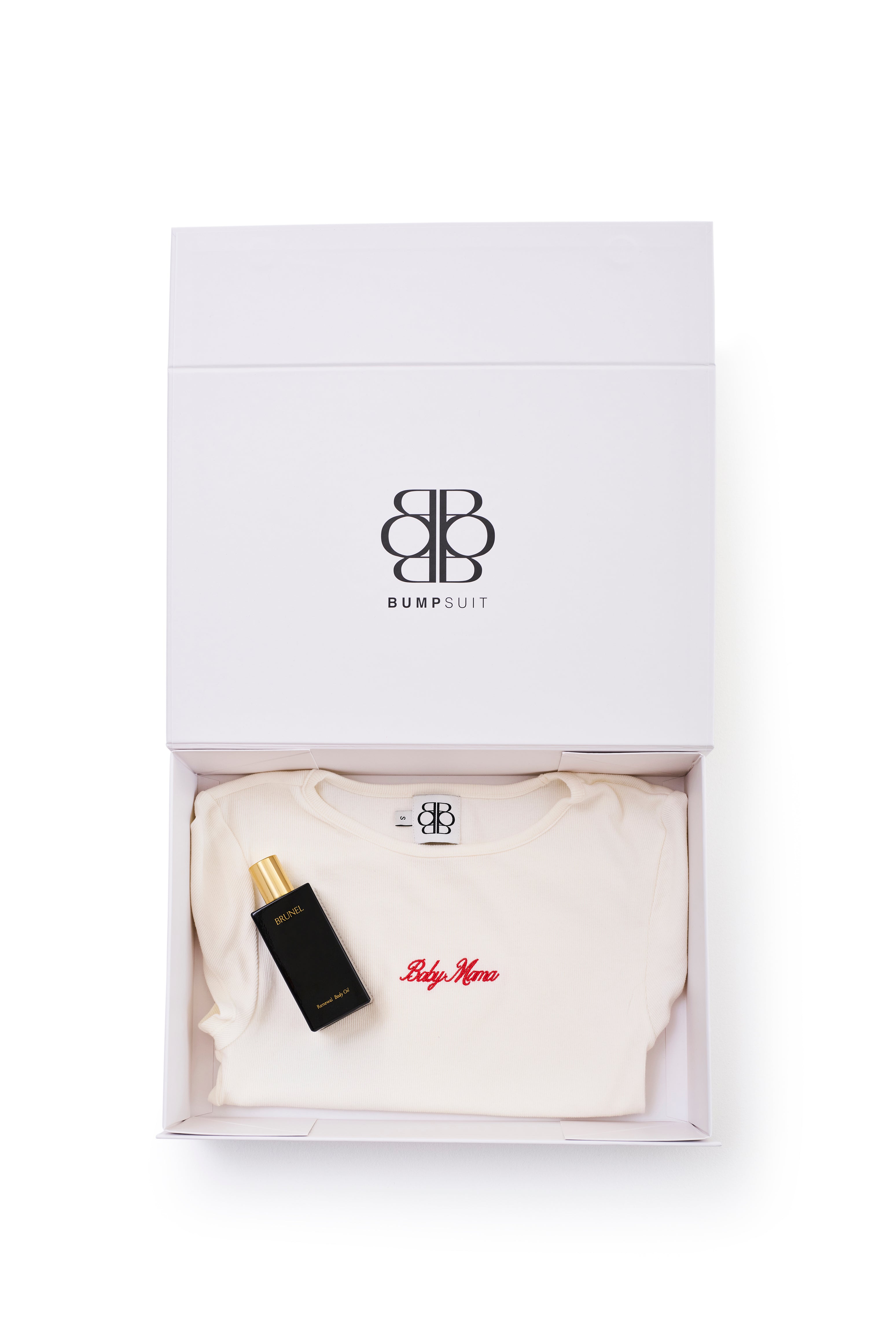 gift set with white baby mama top and black body oil bottle in a branded box on a white background