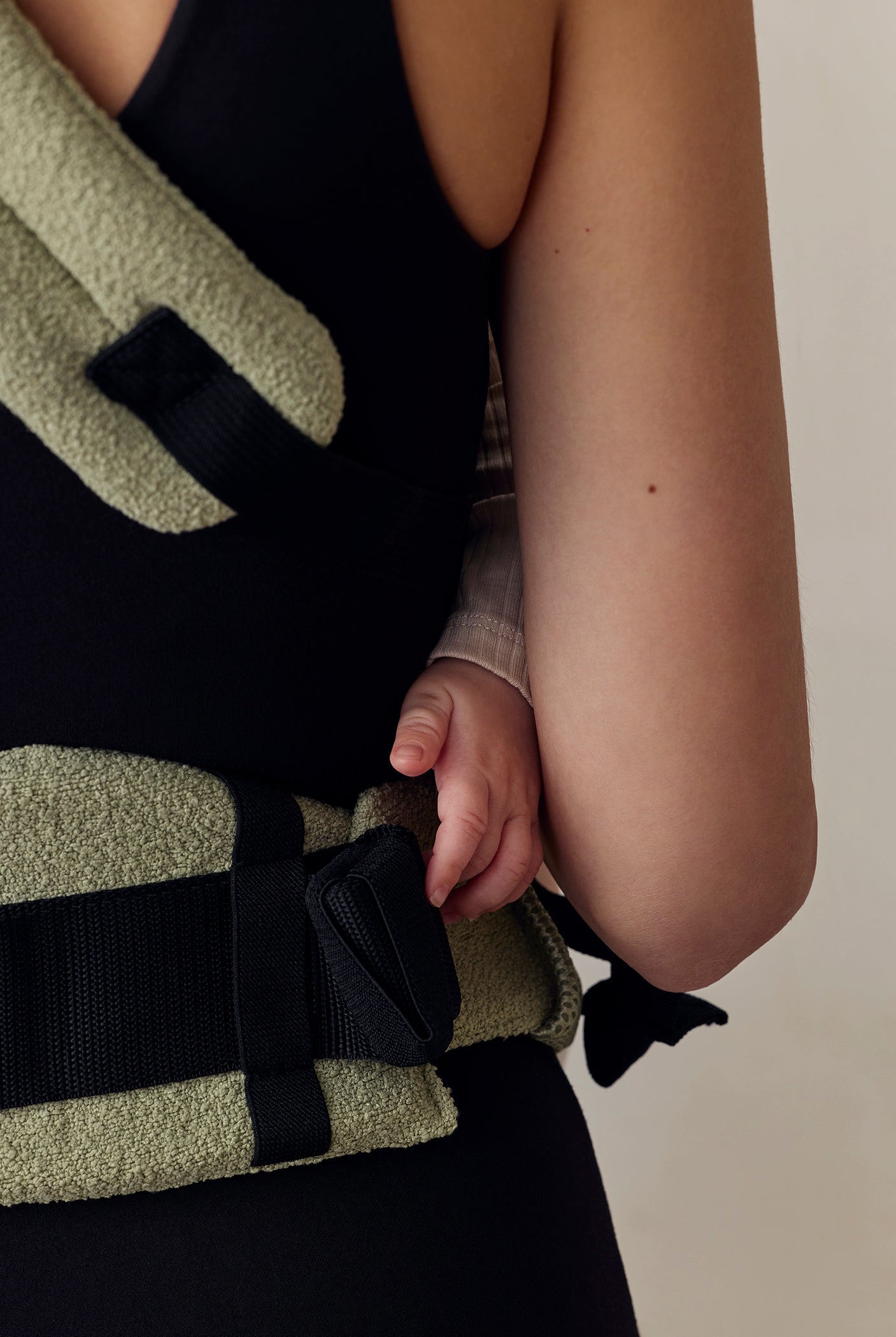 the armadillo baby carrier in matcha