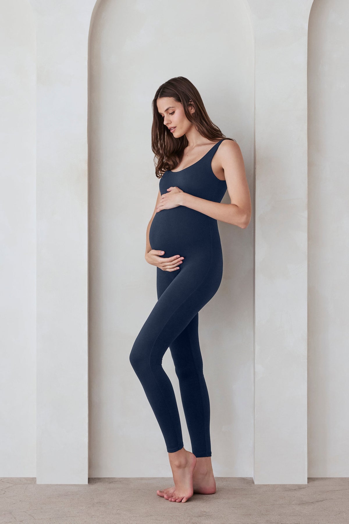 Pregnant woman wearing Bumpsuit Navy Lucy Jumpsuit