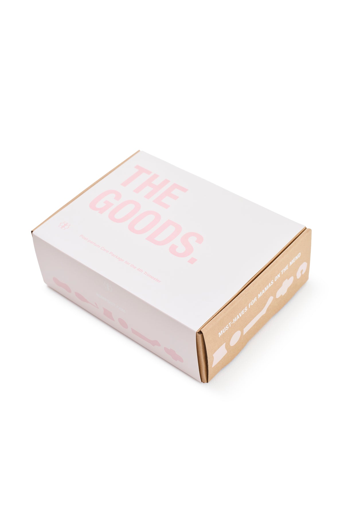 Angled view of THE GOODS postpartum kit care package box showcasing pink branding and postpartum messaging on a white background