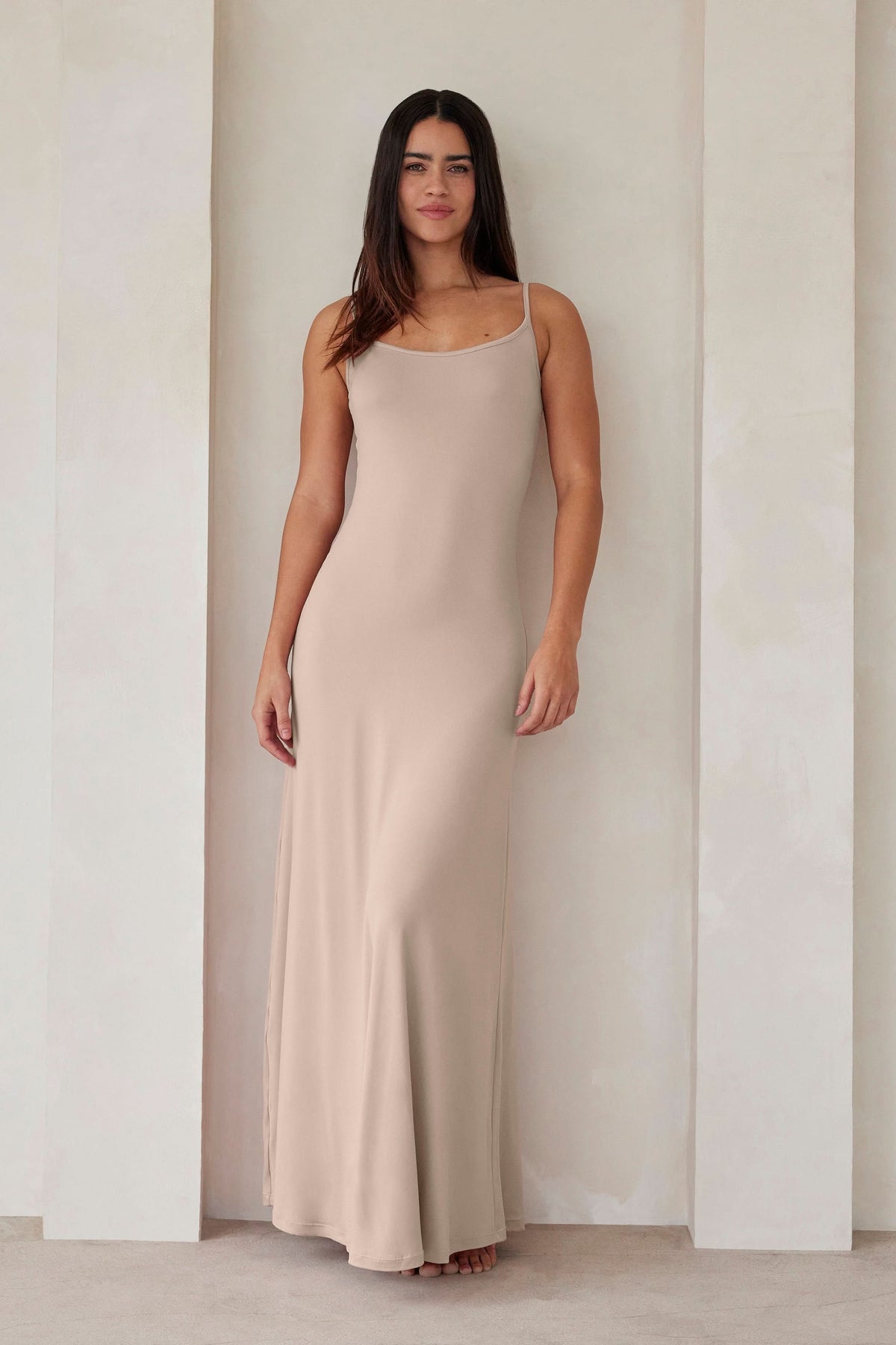 Front view of The Cloud Maxi Dress in oat showcasing thin straps and floor length with a neutral studio background