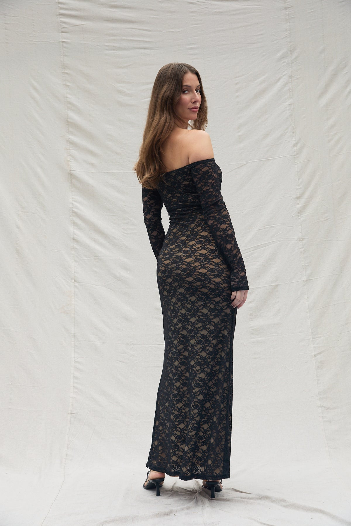back view of the off the shoulders Lace dress by Bumpsuit