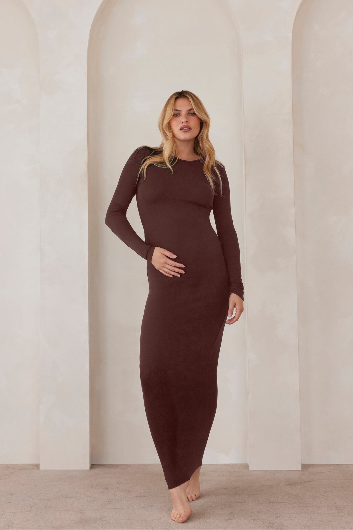 Front view of The Soft Rib Maxi Long Sleeve Dress in chocolate, showing ribbed texture and relaxed fit on model