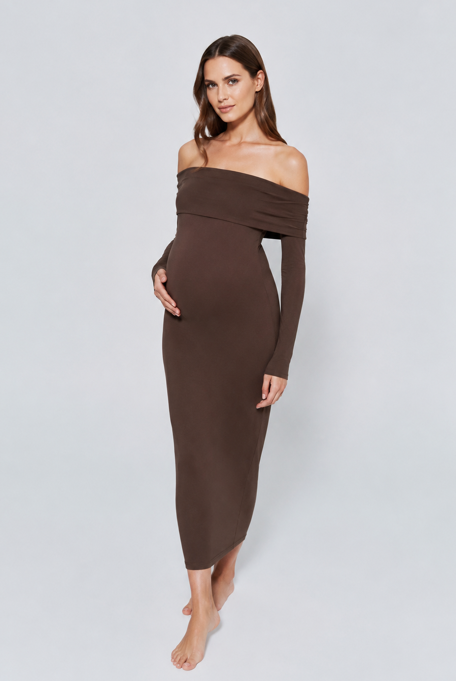 Woman wearing a brown off-shoulder dress on a white background