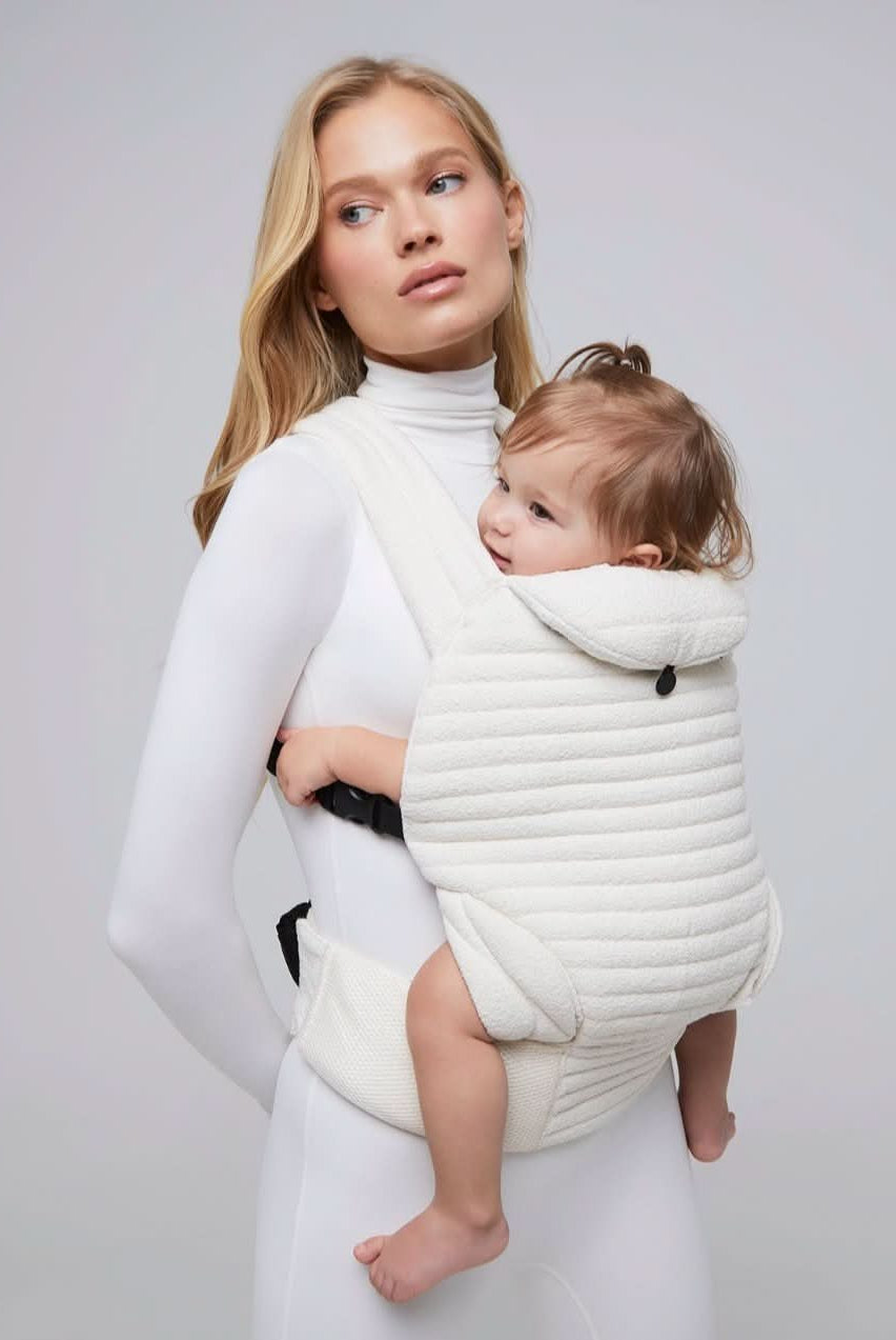 the armadillo baby carrier in cloud bumpsuit vita sidorkina