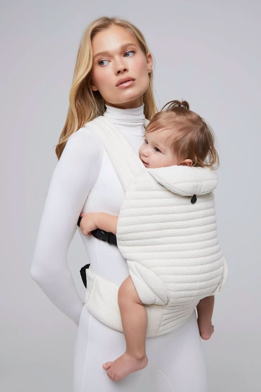 the armadillo baby carrier in cloud bumpsuit vita sidorkina