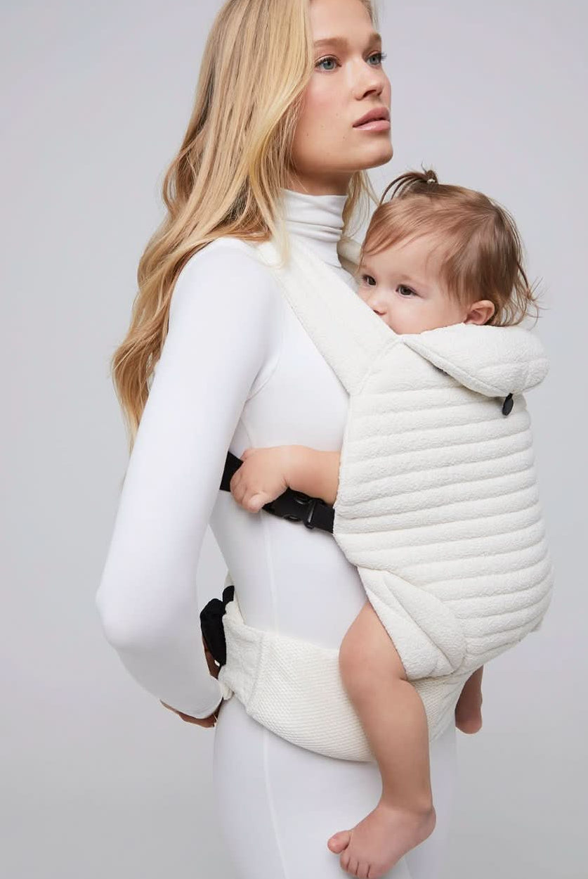 the armadillo baby carrier in cloud bumpsuit vita sidorkina