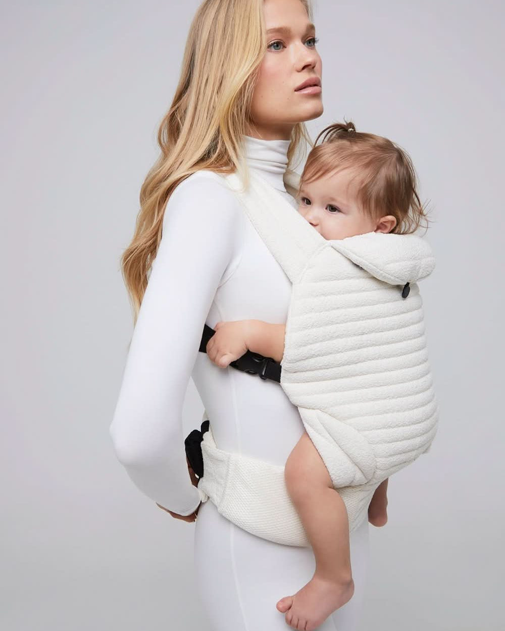 the armadillo baby carrier in cloud bumpsuit vita sidorkina