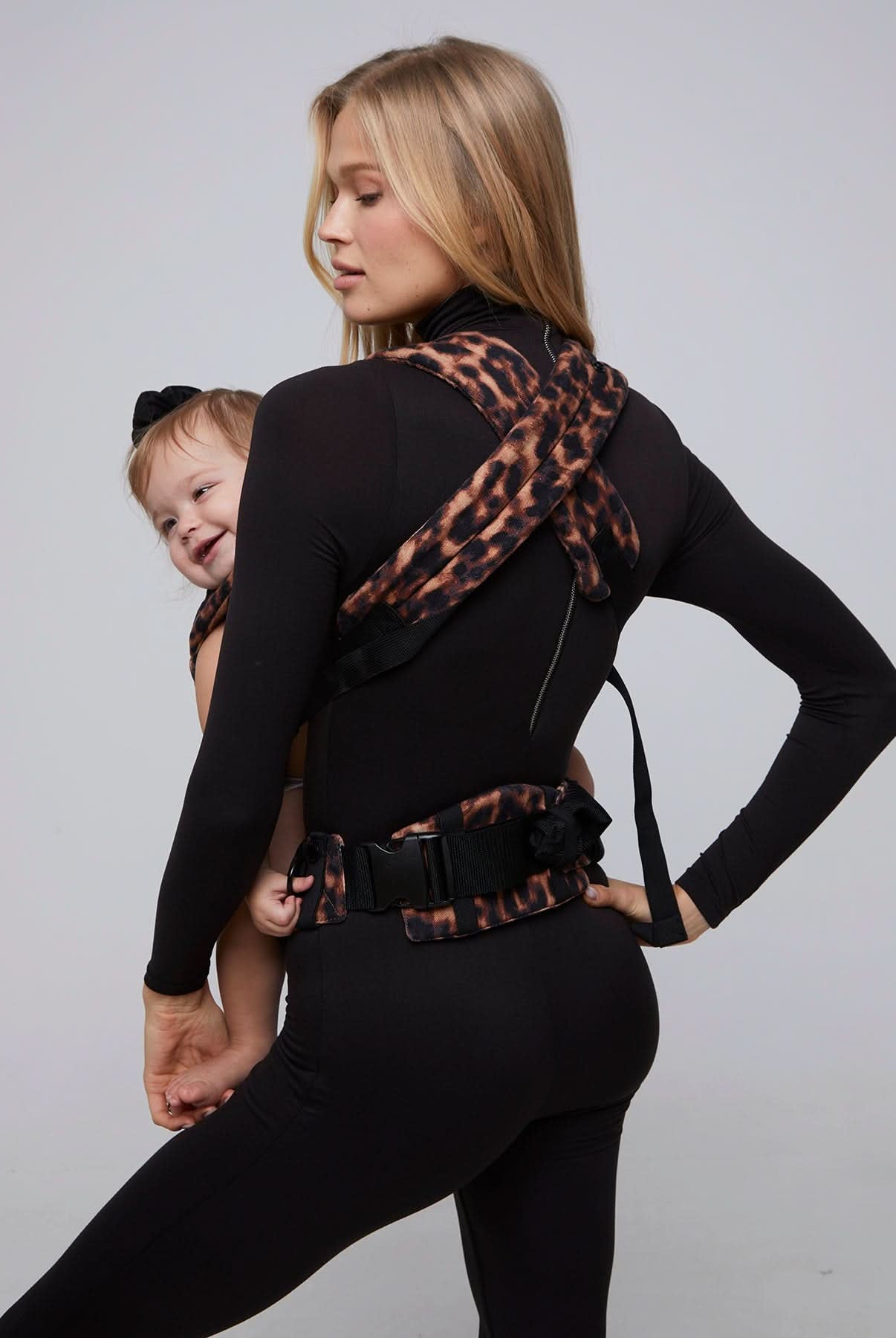 bumpsuit the armadillo baby carrier in leopard worn by vita sidorkina