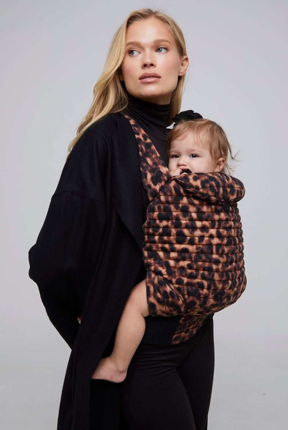 bumpsuit the armadillo baby carrier in leopard worn by vita sidorkina