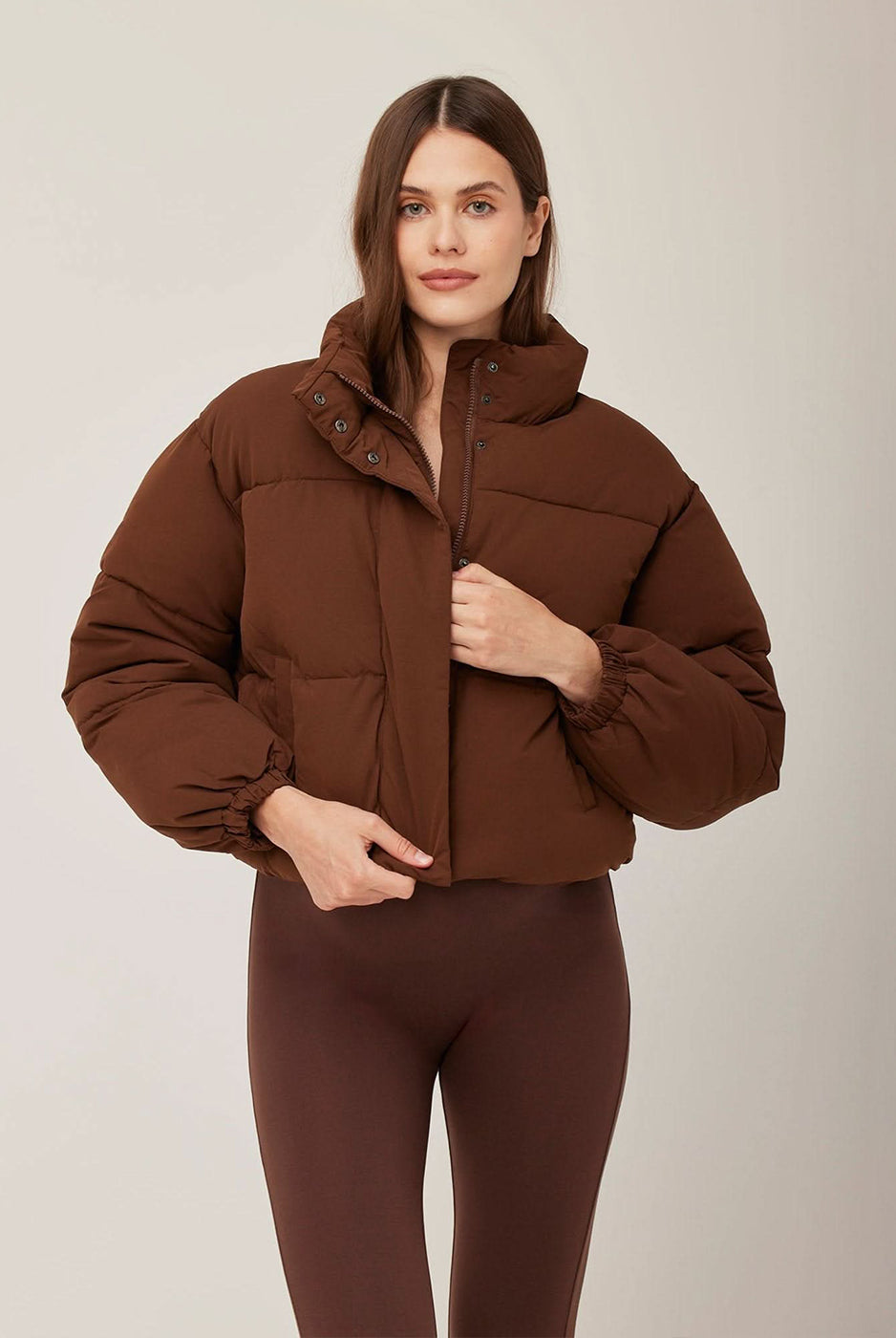 Bumpsuit Maternity Cropped Puffer Jacket in Chocolate worn by Vita Sidorkina