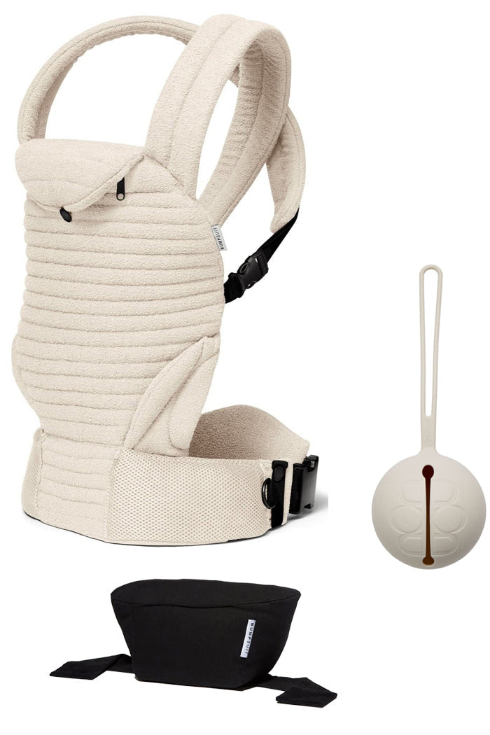 Front view of The Armadillo Set showcasing a cream baby carrier, round pacifier holder, and black pouch on a white background