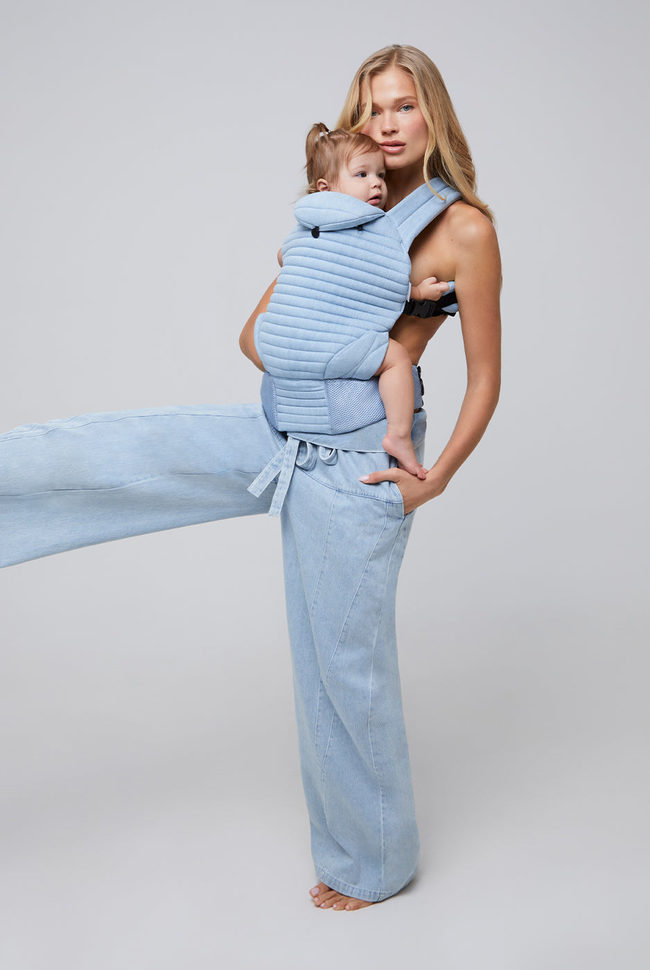 the armadillo baby carrier by bumpsuit in light denim