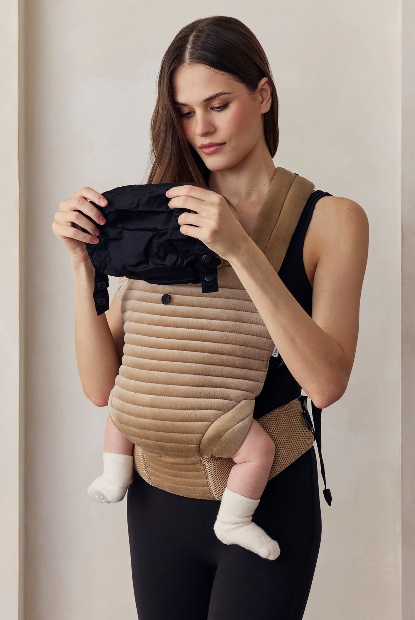 the armadillo baby carrier in dune velvet