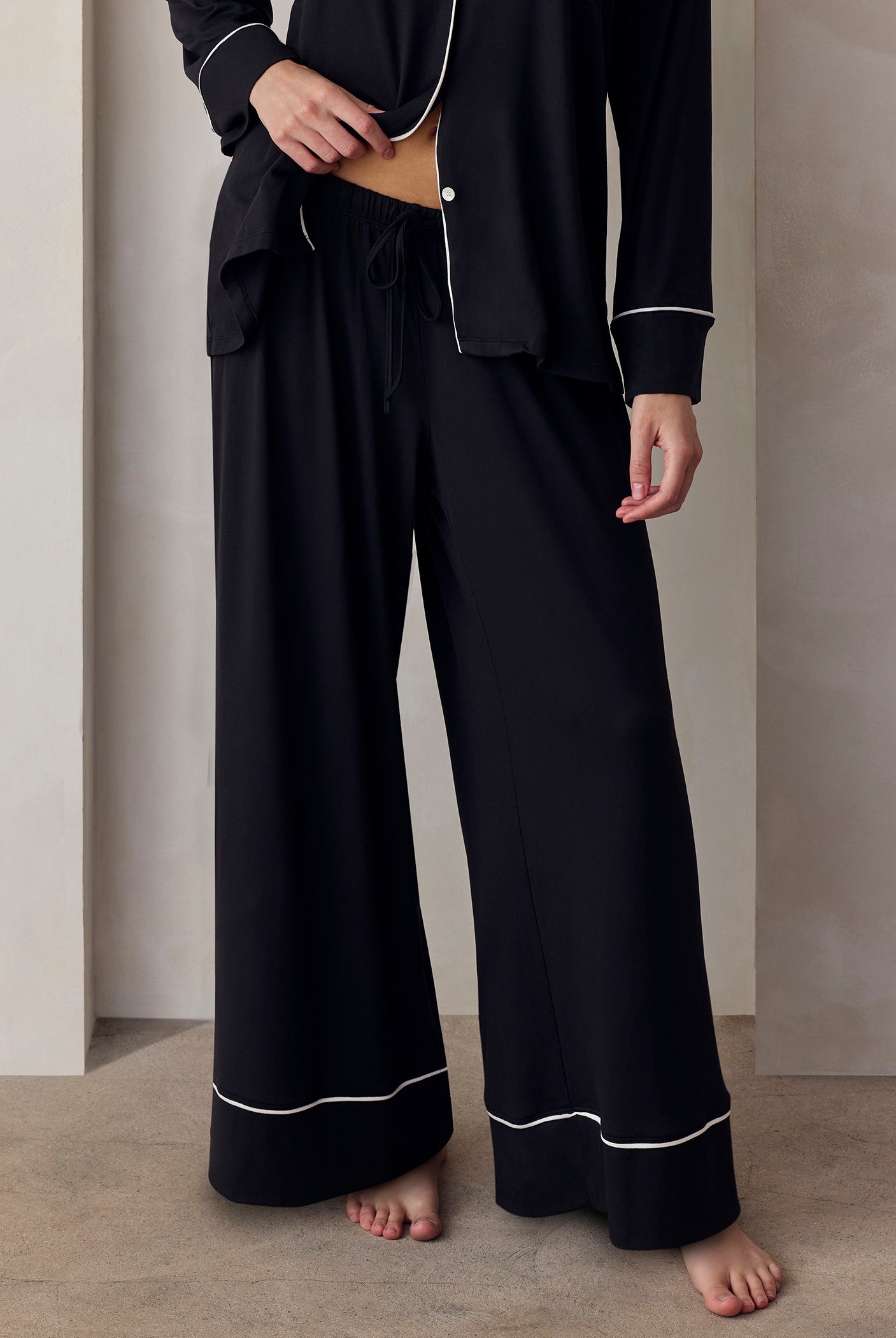 the cloud sleep set in black with white piping detail