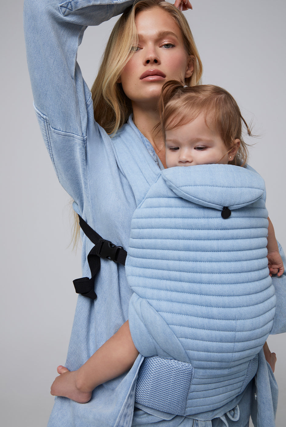 the armadillo baby carrier by bumpsuit in light denim