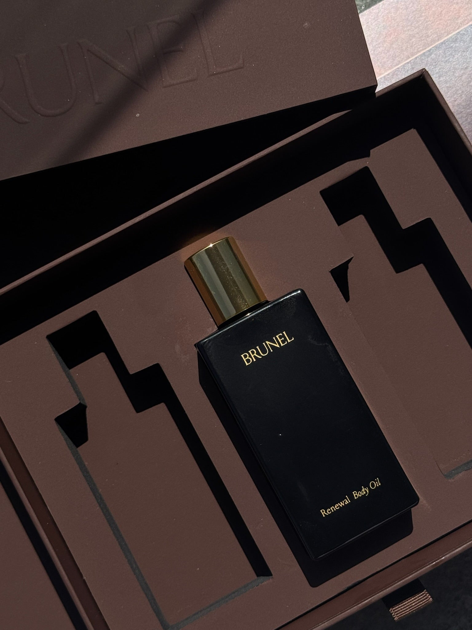 Brunel perfume bottle in a brown packaging box