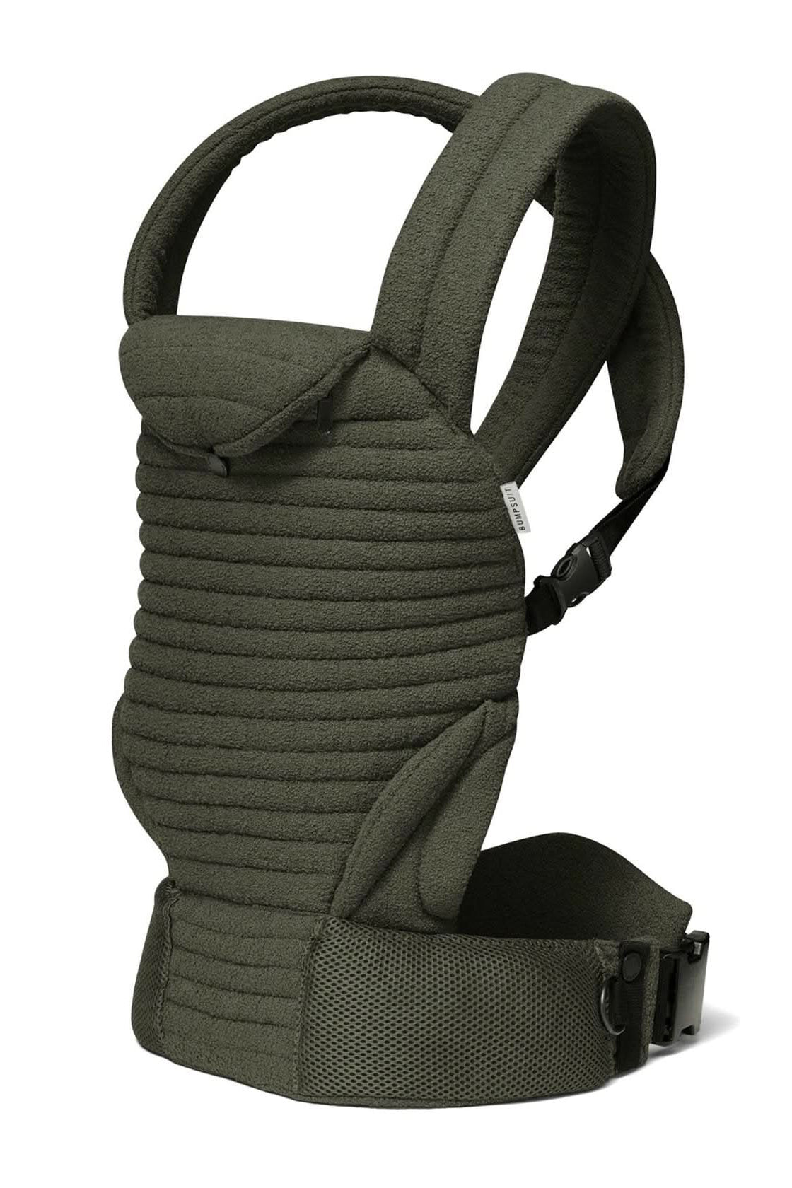 Angled view of the Armadillo Baby Carrier in forest green showcasing padded straps and adjustable waist belt on a white background
