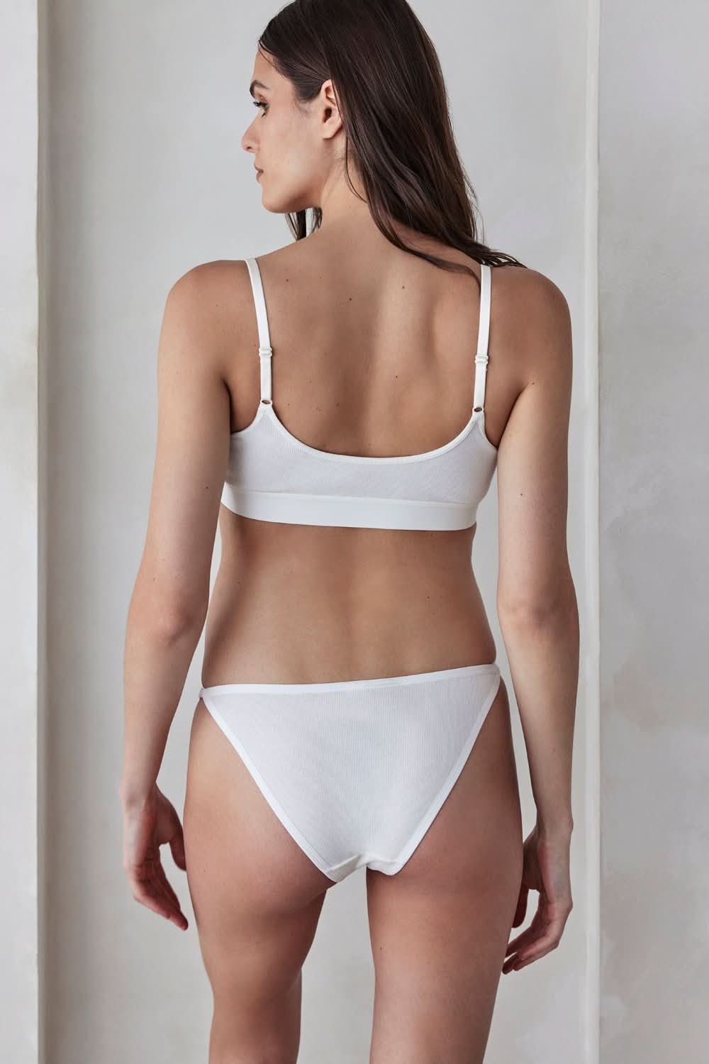 Pregnant model in Bumpsuit Maternity Cotton Rib adjustable brief and Bralette in ivory