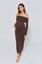 Woman wearing a brown off-shoulder dress on a white background