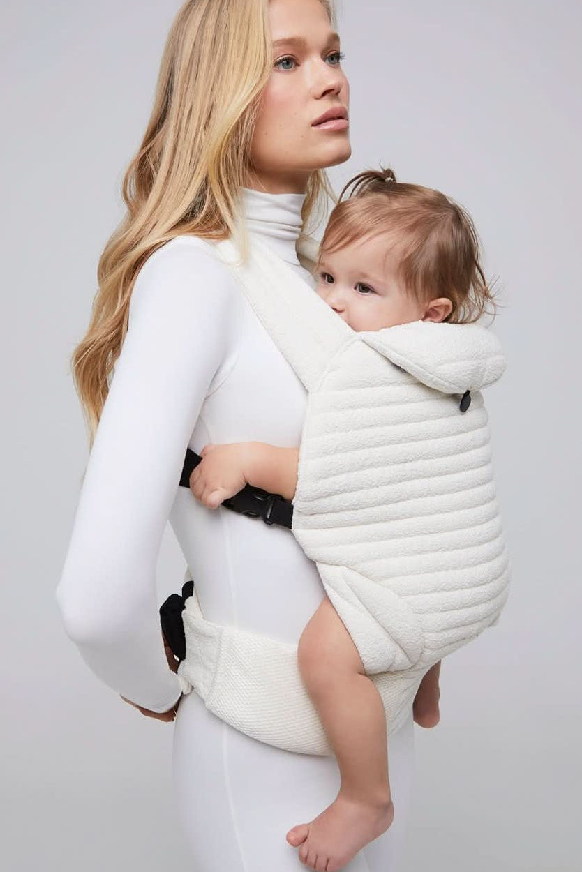 the armadillo baby carrier in cloud bumpsuit vita sidorkina