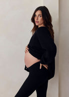 cozy knit turtleneck sweater and flare pant in black