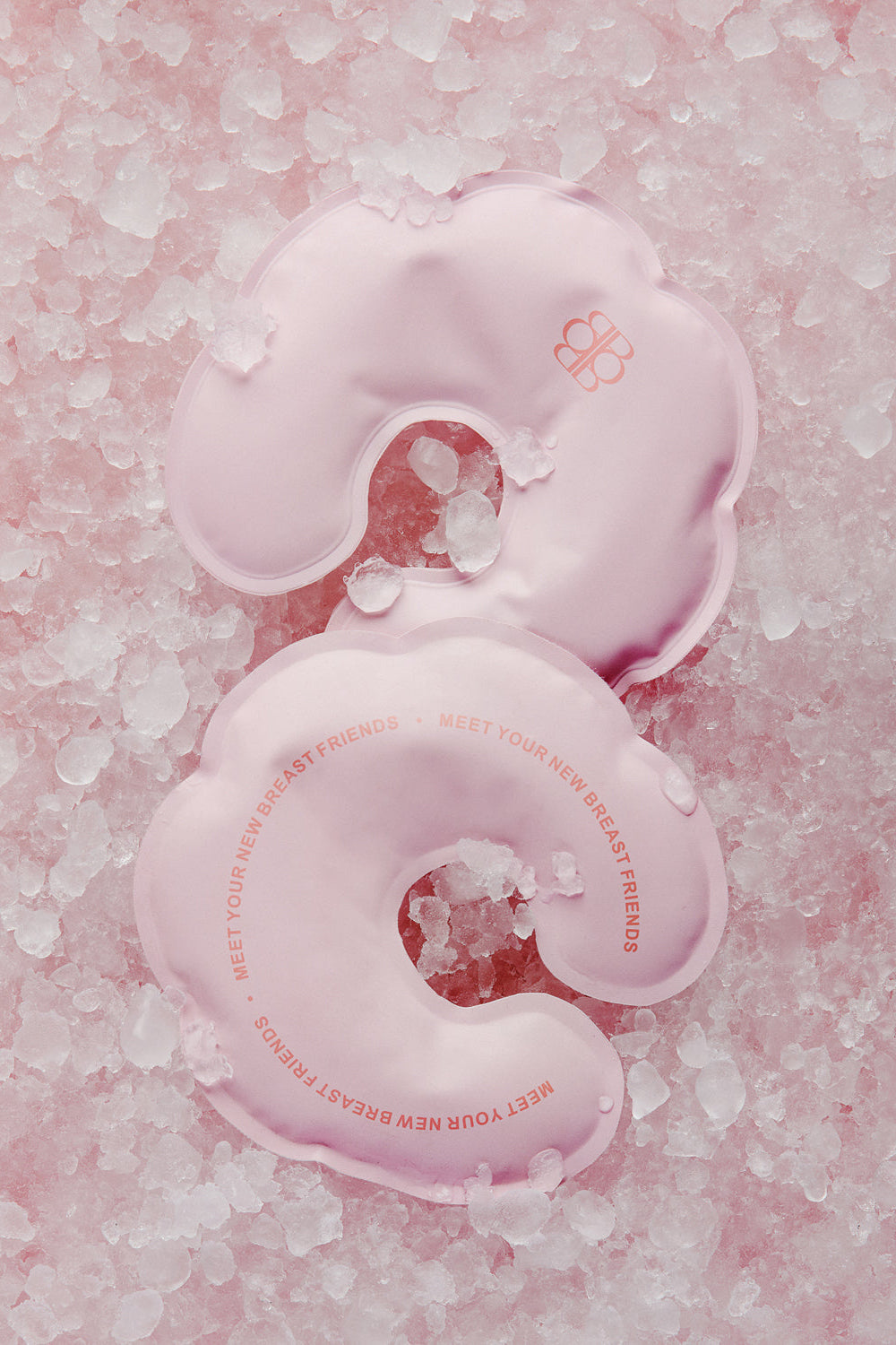 Top view of ICE PINK HOT-N-COLD BREASTIES pair showcasing reusable breast therapy packs on crushed ice