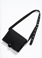Black bumpsuit changing mat crossbody bag with a strap on a white background