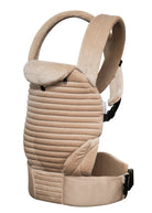 side view of the armadillo baby carrier in a beige velvet on a white background
