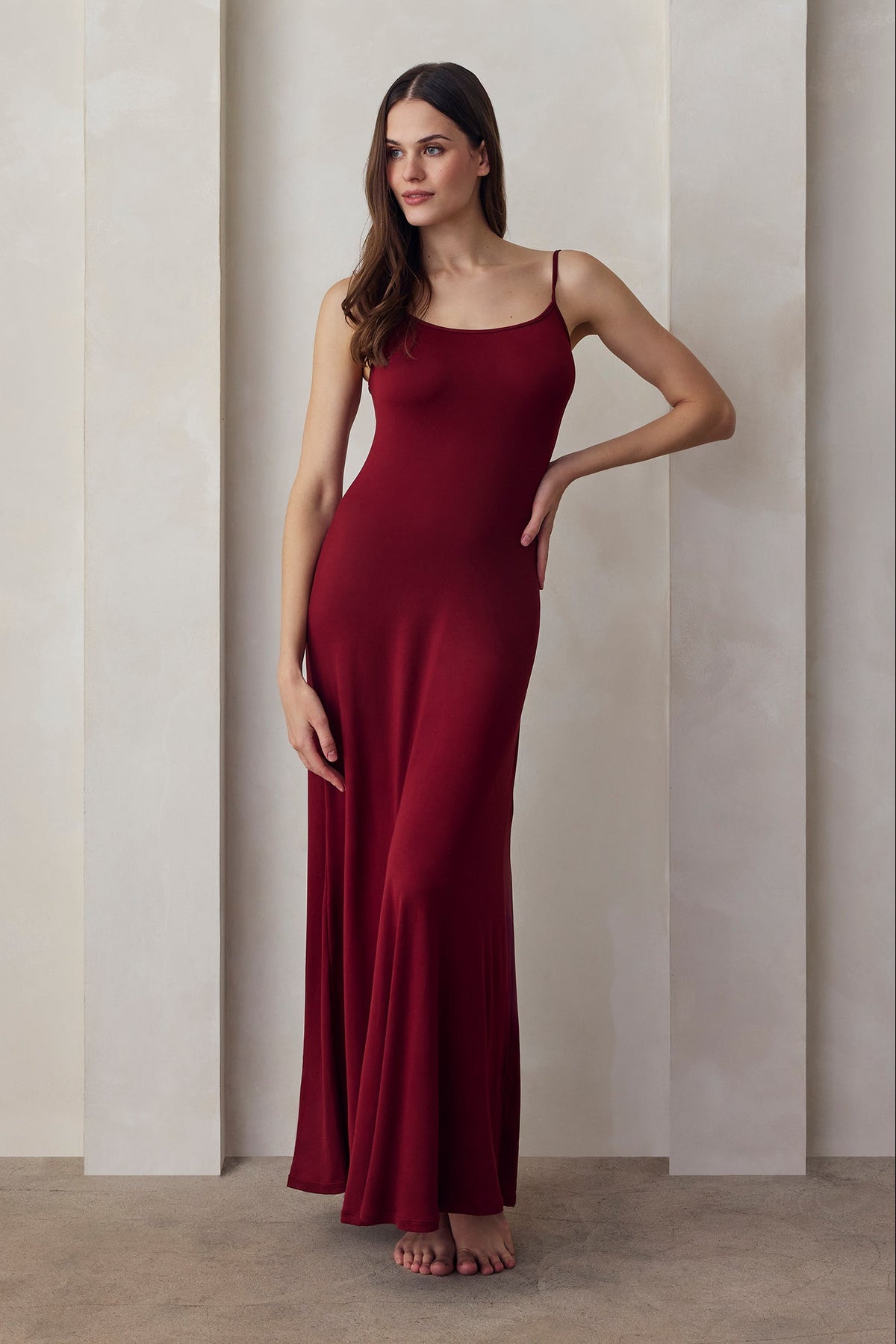Front view of burgundy Cloud Maxi Dress showing relaxed fit, scoop neckline, thin straps, and floor length in a neutral studio