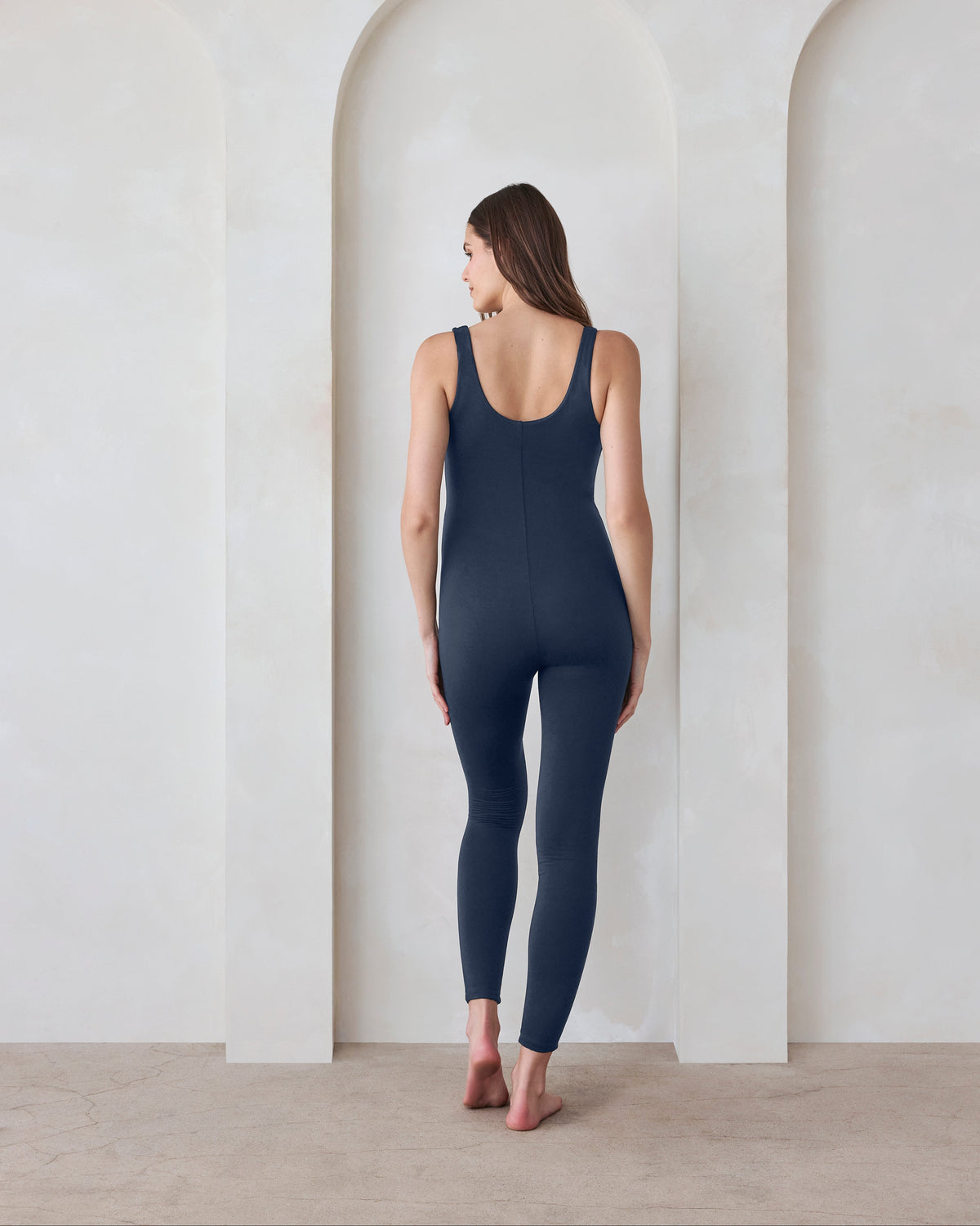 Pregnant woman wearing Bumpsuit Navy Lucy Jumpsuit