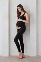 the lucy maternity unitard in black by bumpsuit