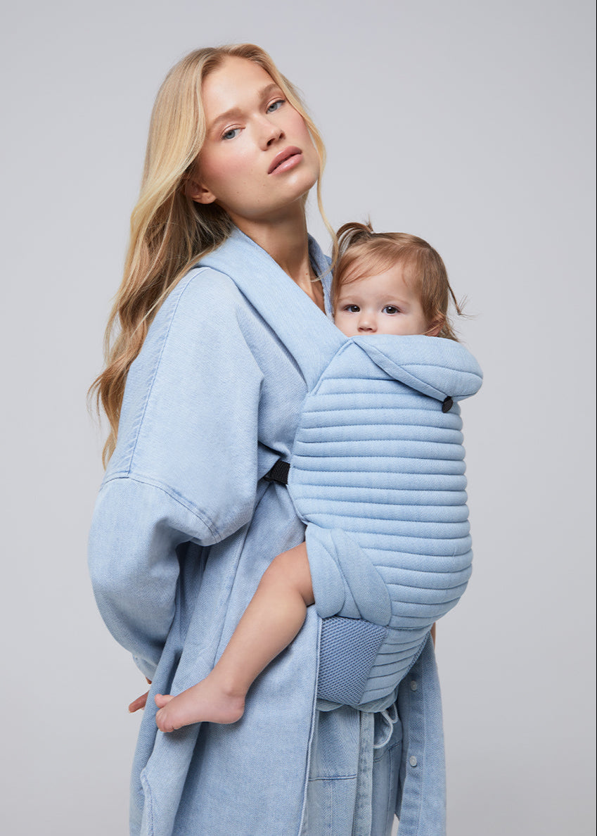 the armadillo baby carrier by bumpsuit in light denim