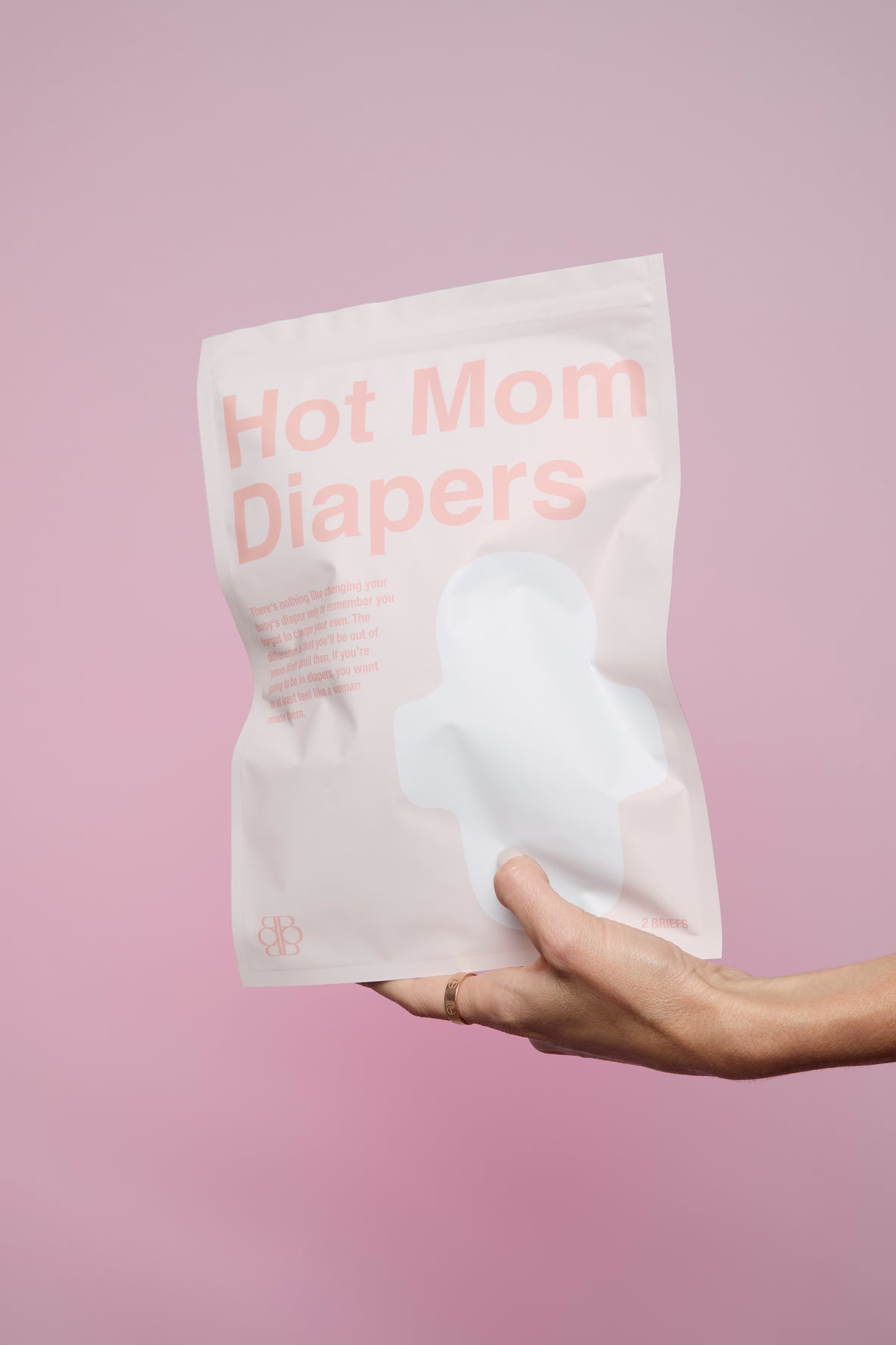 Front view of HOT MOM DIAPERS disposable postpartum panties package showing two briefs included against a pink background